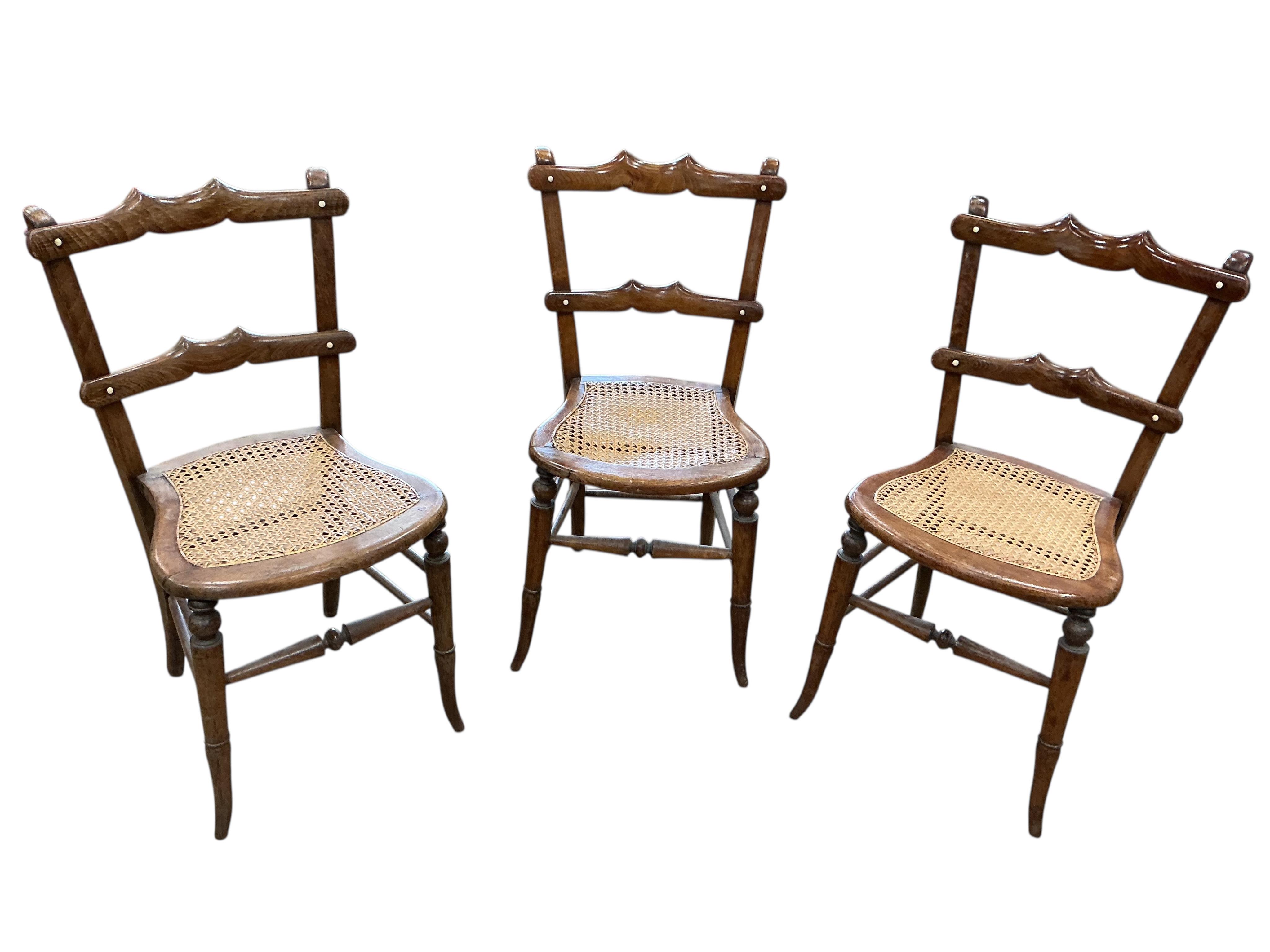 A harlequin set of six 19th century French beech cane seat chairs